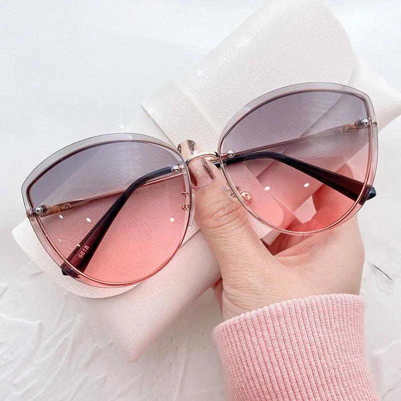 AnnaShade - Stylish Oval Rimless Sunglasses