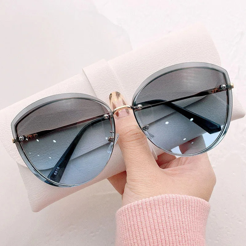 AnnaShade - Stylish Oval Rimless Sunglasses