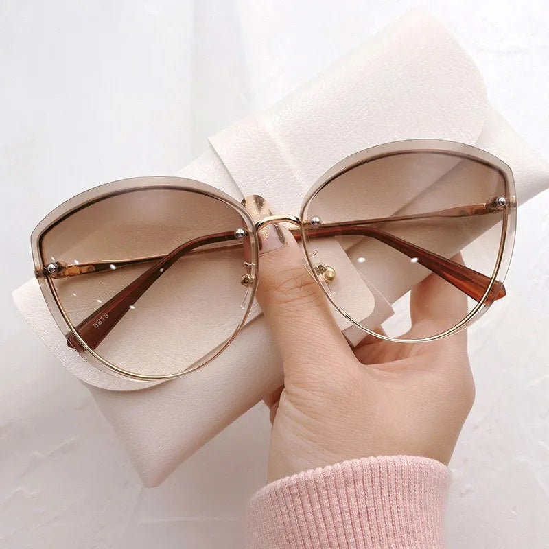 AnnaShade - Stylish Oval Rimless Sunglasses