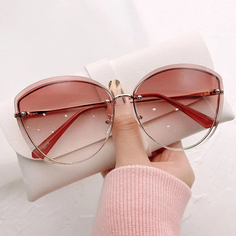 AnnaShade - Stylish Oval Rimless Sunglasses