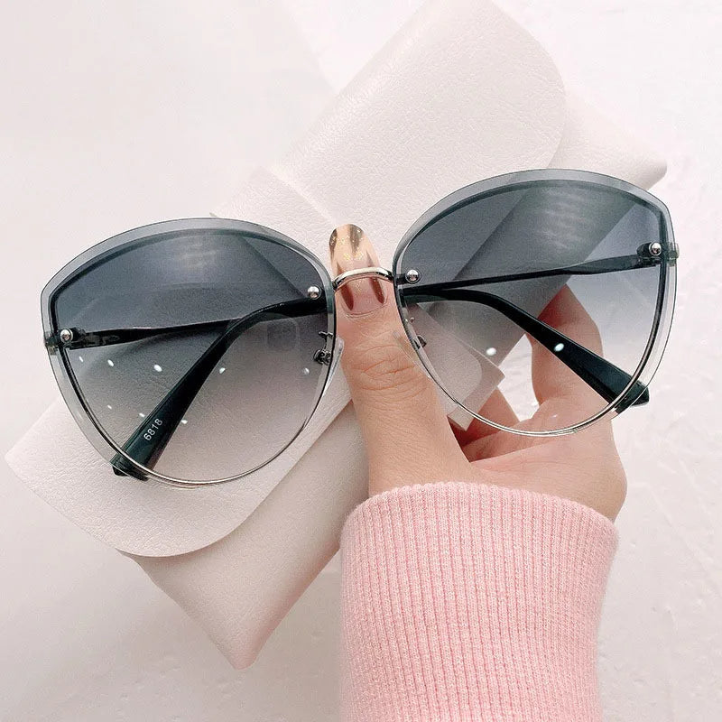AnnaShade - Stylish Oval Rimless Sunglasses