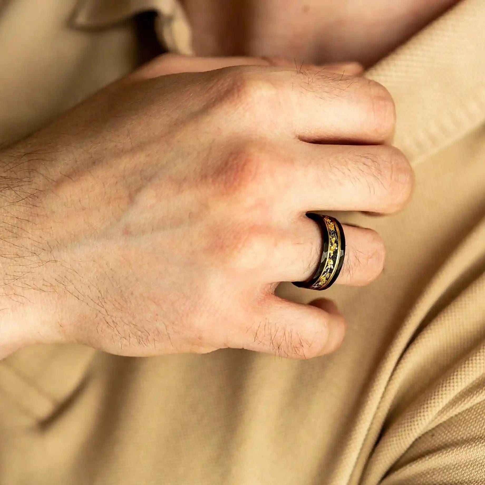 Elegant Orion Ring of Black Meteorite with Luxurious Gold Leaf Details