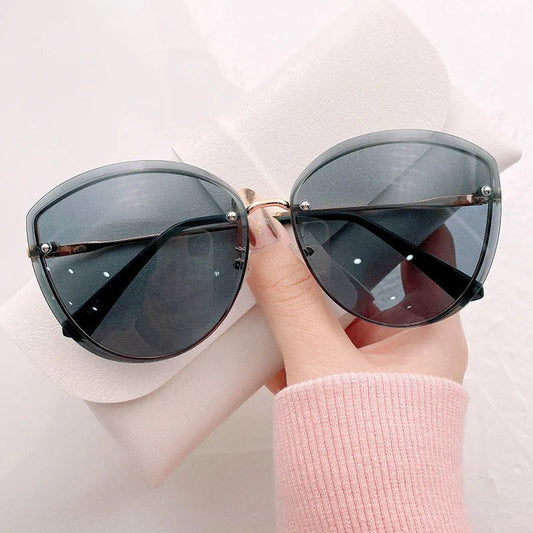 AnnaShade - Stylish Oval Rimless Sunglasses