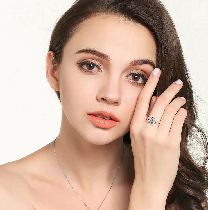 Spoil your loved one with our Enchanting Love Knot Ring - the Perfect Gift!
