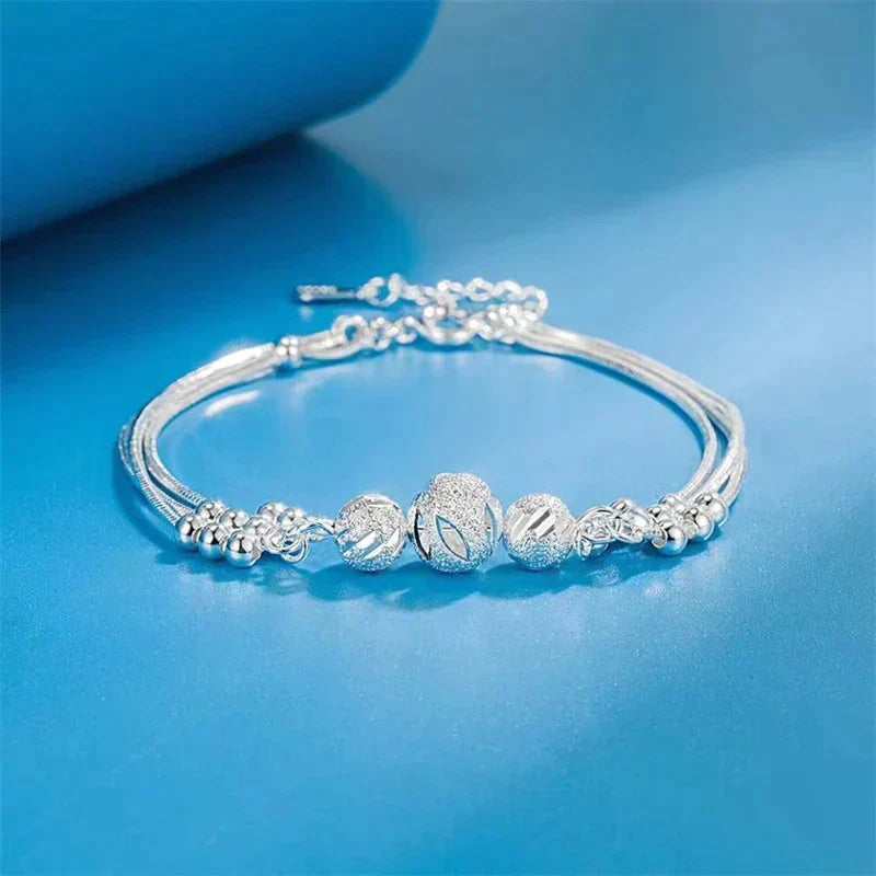 Elegant Silver Bracelet with Multiple Luminous Pearls