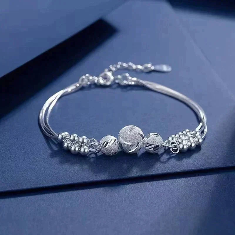 Elegant Silver Bracelet with Multiple Luminous Pearls