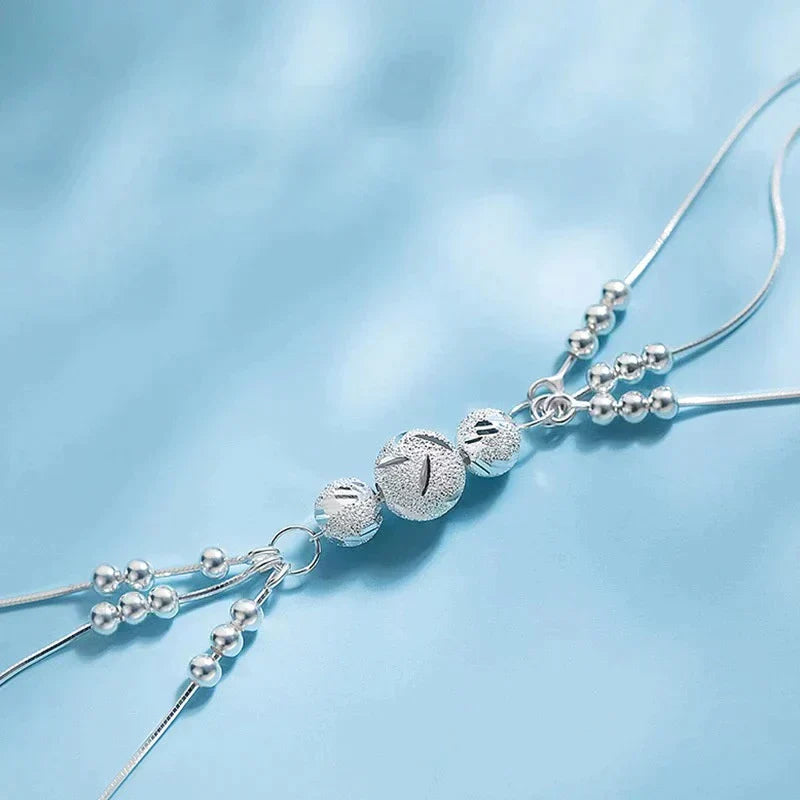 Elegant Silver Bracelet with Multiple Luminous Pearls