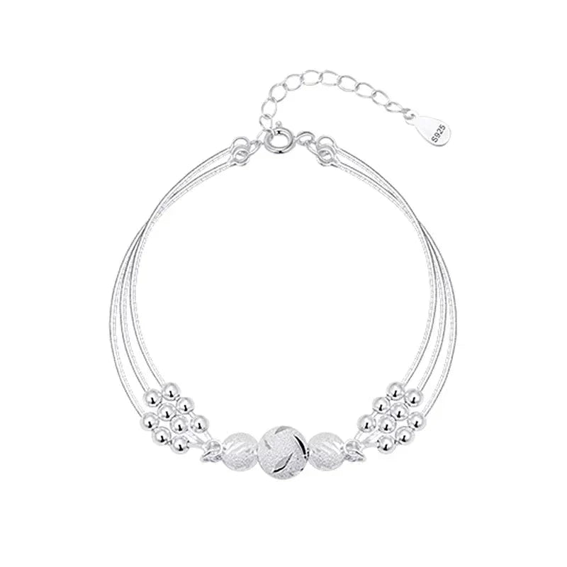 Elegant Silver Bracelet with Multiple Luminous Pearls