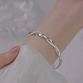 Elegant Twisted Silver Bangle