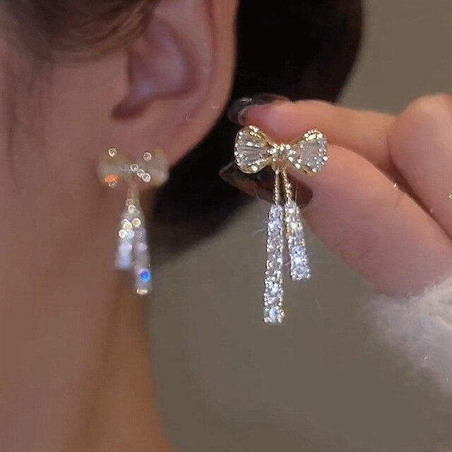 Chic Gold Bow Earrings with Stylish Cubic Zirconia - Arlette