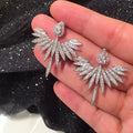 Elegant Celeste Silver Angel Wing Stud Earrings
