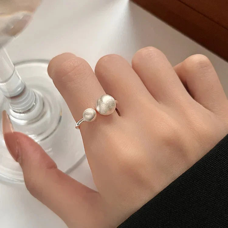 Elegant Brushed Silver Ring with Refined Connected Pearls - Elara